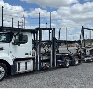 2014 D11 Volvo that holds 5 vehicles