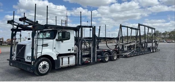 2014 D11 Volvo that holds 5 vehicles